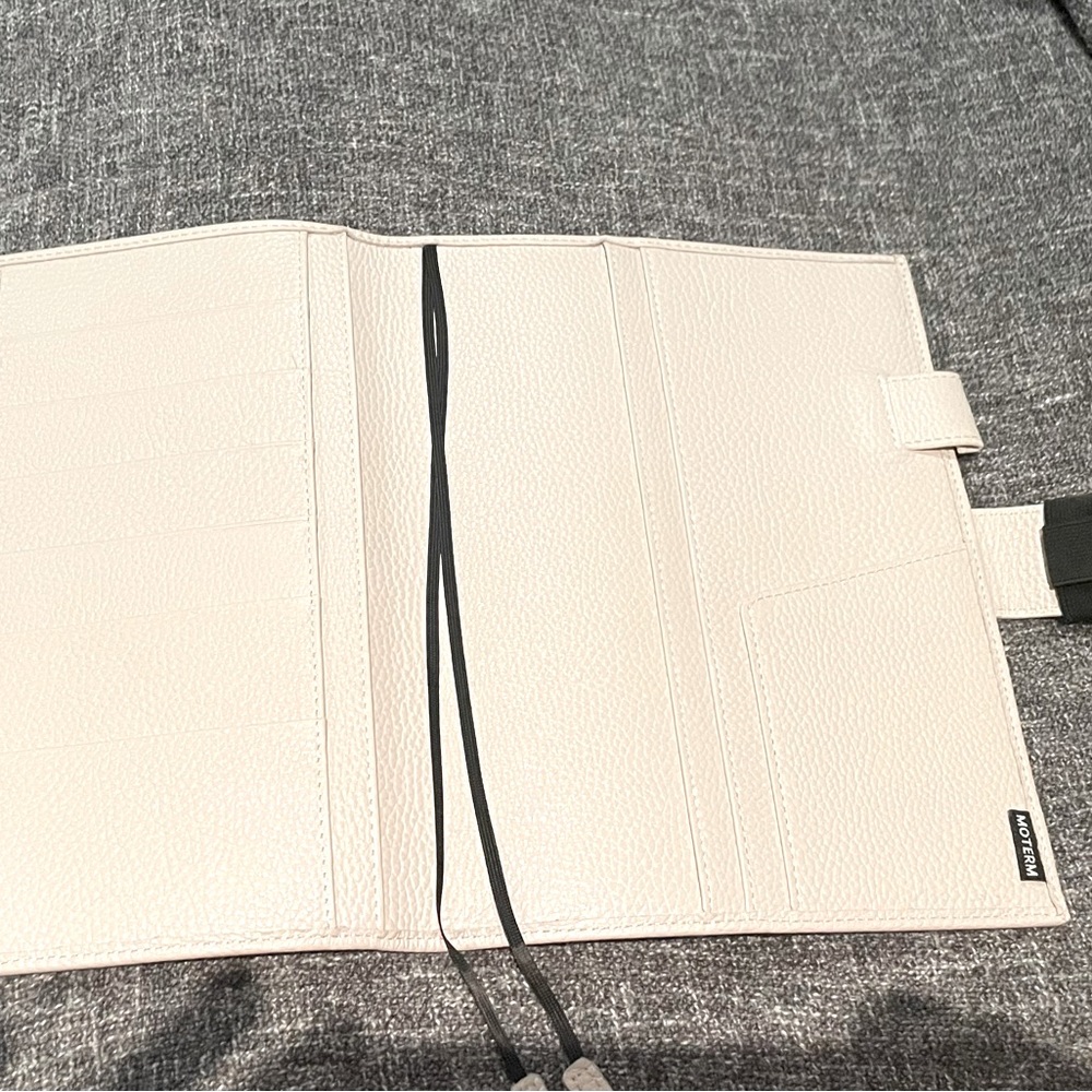 Moterm A5 white cover.  Can insert a5 notebook.  Brand new never used